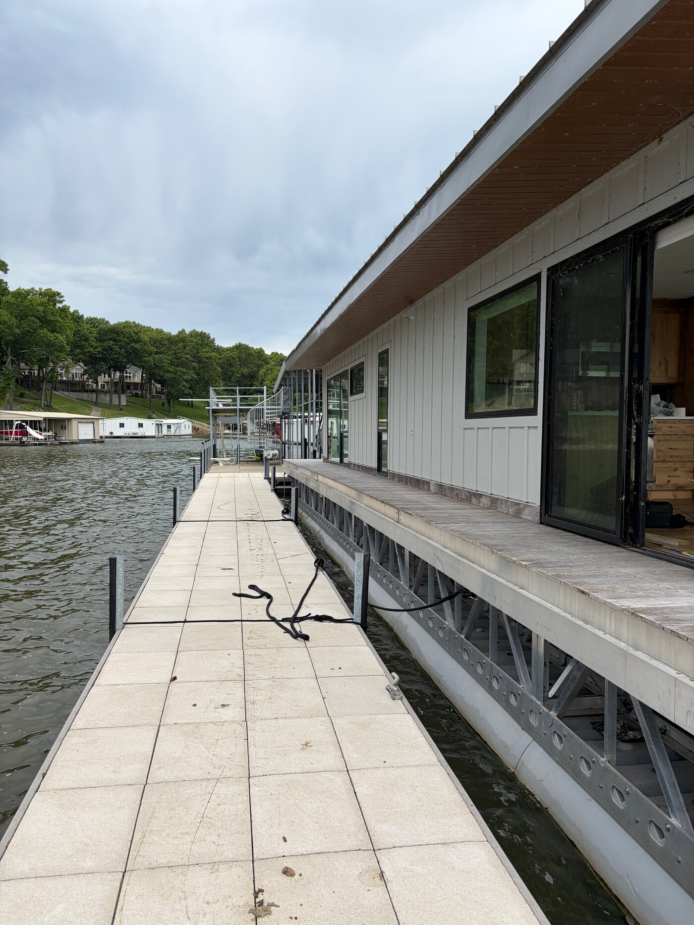 Electric outboard controls, wheel, and Garmin display at the helm